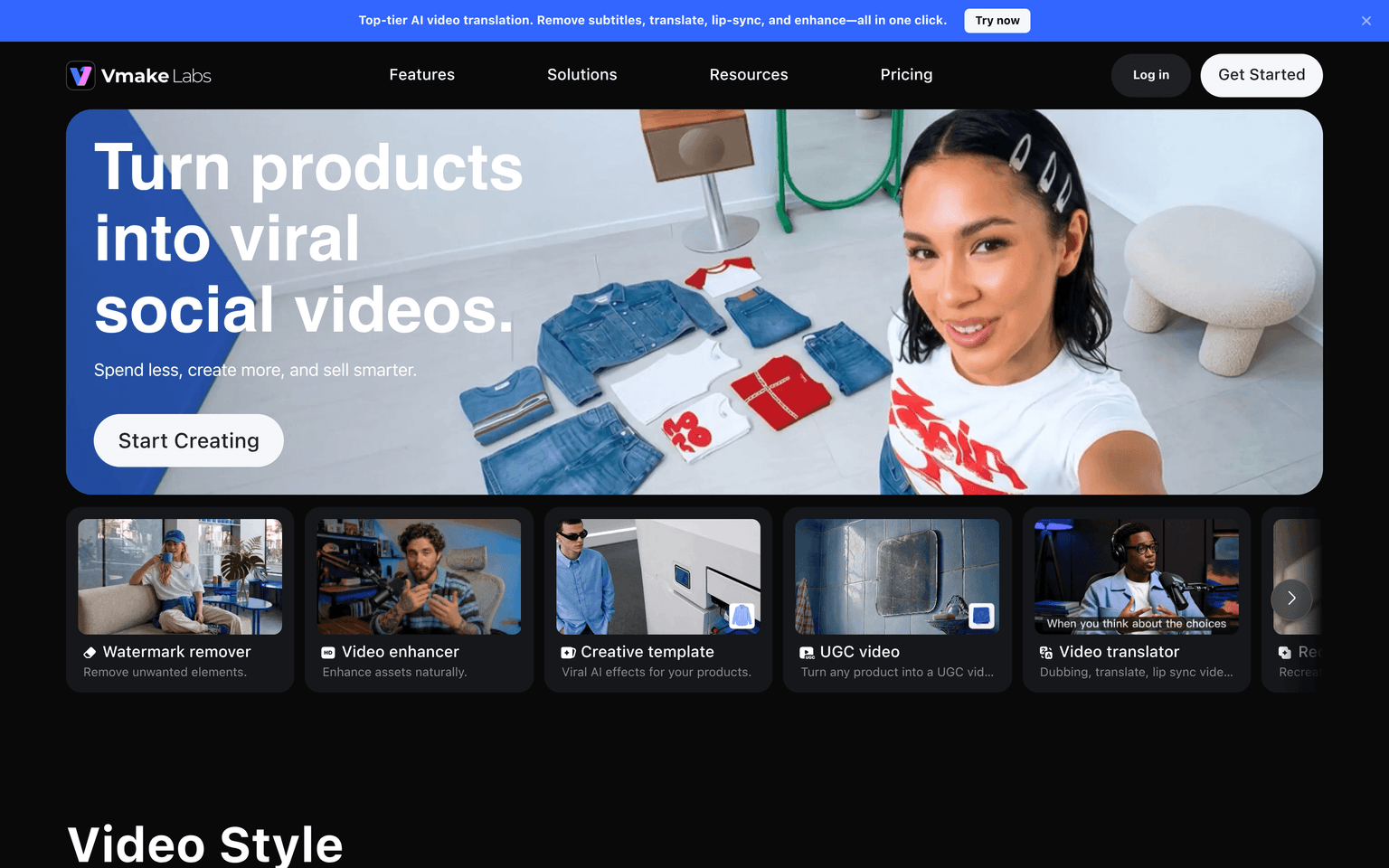 Vmake landing page hero reading turn products into viral social videos, with feature cards